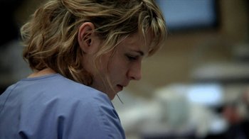Movie still from “A Horrible Way to Die” (2010), directed by Adam Wingard – A person wearing a blue shirt; Close Up shot, Low angle