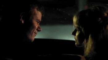 Movie still from “A Horrible Way to Die” (2010), directed by Adam Wingard – A man and a woman face to face in the dark; Close Up shot, Over the shoulder angle