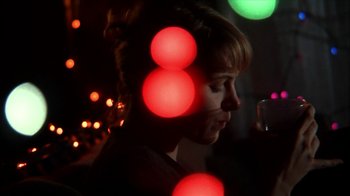 Movie still from “A Horrible Way to Die” (2010), directed by Adam Wingard – A woman with red lights in the background; Close Up shot, Low angle