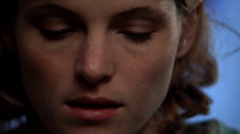 Movie still from “A Horrible Way to Die” (2010), directed by Adam Wingard – A woman's face with her eyes closed; Extreme Close Up shot, Overhead angle