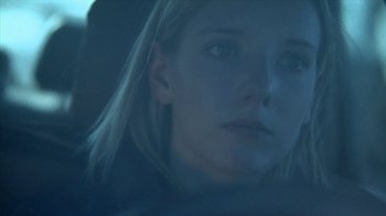 Movie still from “A Horrible Way to Die” (2010), directed by Adam Wingard – A young woman is sitting in a car looking out the window; Close Up shot, Low angle