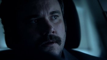 Movie still from “A Horrible Way to Die” (2010), directed by Adam Wingard – A person in a car looking at the camera; Close Up shot, Low angle