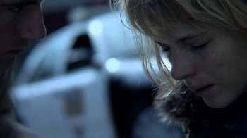 Movie still from “A Horrible Way to Die” (2010), directed by Adam Wingard – A woman's face with lights in the background; Close Up shot, Low angle