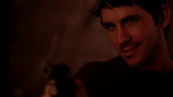 Movie still from “A Horrible Way to Die” (2010), directed by Adam Wingard – A person holding a gun; Close Up shot, Over the shoulder angle