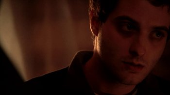 Movie still from “A Horrible Way to Die” (2010), directed by Adam Wingard – A man's face in the dark; Close Up shot, Low angle