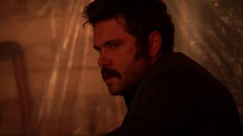 Movie still from “A Horrible Way to Die” (2010), directed by Adam Wingard – A person with a beard and mustache; Close Up shot, Low angle