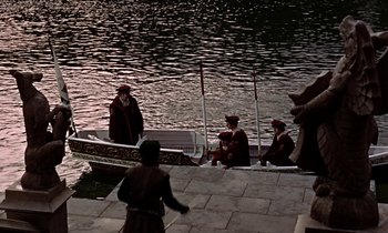 Movie still from “A Man for All Seasons” (1966), directed by Fred Zinnemann – A group of people sitting in a boat on a body of water; Extreme Wide shot, High angle