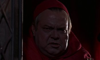 Movie still from “A Man for All Seasons” (1966), directed by Fred Zinnemann – A person wearing a red robe; Close Up shot, Low angle