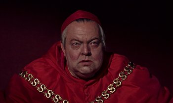 Movie still from “A Man for All Seasons” (1966), directed by Fred Zinnemann – A person wearing a red robe; Close Up shot, High angle