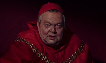 Movie still from “A Man for All Seasons” (1966), directed by Fred Zinnemann – A person wearing a red robe; Close Up shot, High angle