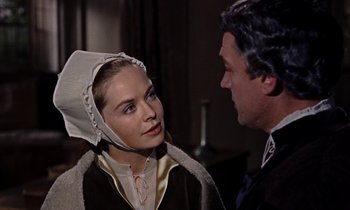 Movie still from “A Man for All Seasons” (1966), directed by Fred Zinnemann – A man and a woman wearing a hat; Close Up shot, Over the shoulder angle