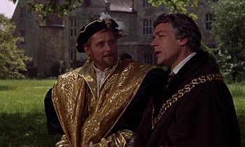 Movie still from “A Man for All Seasons” (1966), directed by Fred Zinnemann – Two men dressed in medieval garb talking to each other; Medium shot, Over the shoulder angle