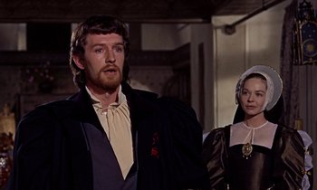 Movie still from “A Man for All Seasons” (1966), directed by Fred Zinnemann – A man and a woman standing next to each other; Medium shot, Over the shoulder angle