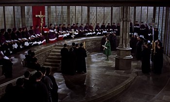 Movie still from “A Man for All Seasons” (1966), directed by Fred Zinnemann – A group of people standing in front of a group of judges; Extreme Wide shot, High angle