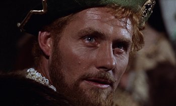 Movie still from “A Man for All Seasons” (1966), directed by Fred Zinnemann – A person with a beard wearing a hat; Close Up shot, Over the shoulder angle