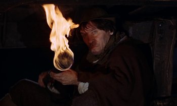 Movie still from “A Man for All Seasons” (1966), directed by Fred Zinnemann – A man holding a glass in his hands; Close Up shot, Low angle