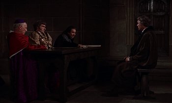 Movie still from “A Man for All Seasons” (1966), directed by Fred Zinnemann – A group of people sitting around a table; Wide shot, Over the shoulder angle
