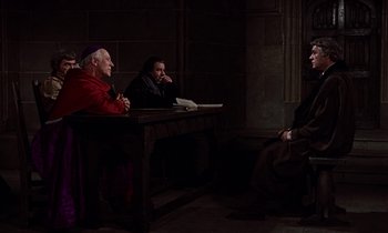 Movie still from “A Man for All Seasons” (1966), directed by Fred Zinnemann – A group of men sitting at a table in front of a window; Medium shot, High angle