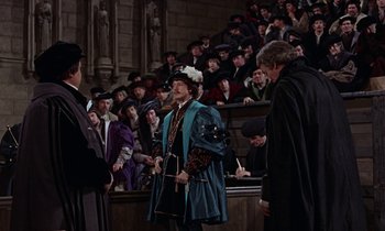Movie still from “A Man for All Seasons” (1966), directed by Fred Zinnemann – A crowd of people sitting in front of an audience; Wide shot, High angle