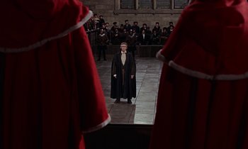 Movie still from “A Man for All Seasons” (1966), directed by Fred Zinnemann – A man standing in front of a group of people; Extreme Wide shot, High angle