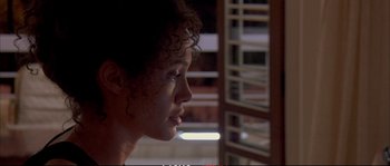 Movie still from “A Mighty Heart” (2007), directed by Michael Winterbottom – A person with curly hair; Close Up shot, Over the shoulder angle