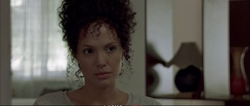 Movie still from “A Mighty Heart” (2007), directed by Michael Winterbottom – A person with curly hair; Close Up shot, Over the shoulder angle