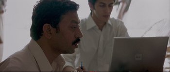 Movie still from “A Mighty Heart” (2007), directed by Michael Winterbottom – Two men are looking at a computer screen; Close Up shot, Low angle