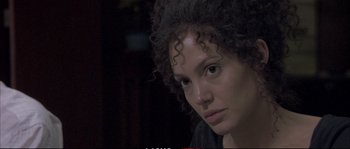 Movie still from “A Mighty Heart” (2007), directed by Michael Winterbottom – A person with curly brown hair; Close Up shot, Over the shoulder angle