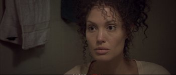 Movie still from “A Mighty Heart” (2007), directed by Michael Winterbottom – A person with curly hair; Close Up shot, Over the shoulder angle