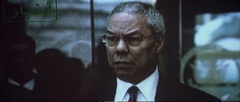 Movie still from “A Mighty Heart” (2007), directed by Michael Winterbottom – An older black man wearing a suit and tie; Close Up shot, Low angle