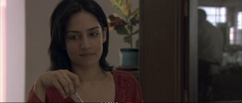 Movie still from “A Mighty Heart” (2007), directed by Michael Winterbottom – A woman is sitting in front of a mirror; Close Up shot, Over the shoulder angle