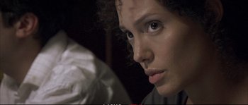 Movie still from “A Mighty Heart” (2007), directed by Michael Winterbottom – A woman's face in the dark; Close Up shot, Over the shoulder angle