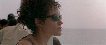 Movie still from “A Mighty Heart” (2007), directed by Michael Winterbottom – A person wearing a pair of sunglasses; Close Up shot, Low angle