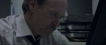 Movie still from “A Mighty Heart” (2007), directed by Michael Winterbottom – A person wearing a shirt and tie; Close Up shot, Low angle