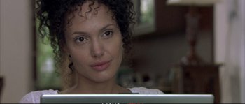 Movie still from “A Mighty Heart” (2007), directed by Michael Winterbottom – A person using a laptop computer; Close Up shot, Over the shoulder angle