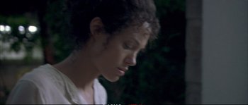 Movie still from “A Mighty Heart” (2007), directed by Michael Winterbottom – A young woman is looking down at her face; Close Up shot, High angle