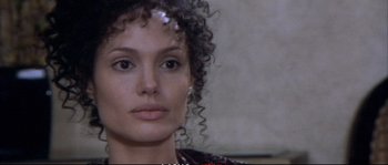 Movie still from “A Mighty Heart” (2007), directed by Michael Winterbottom – A person with curly hair; Close Up shot, Over the shoulder angle