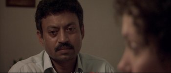 Movie still from “A Mighty Heart” (2007), directed by Michael Winterbottom – A person sitting in front of another person; Close Up shot, Over the shoulder angle