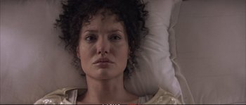Movie still from “A Mighty Heart” (2007), directed by Michael Winterbottom – A person laying in a bed; Close Up shot, Overhead angle