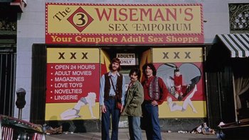 Movie still from “A Mighty Wind” (2003), directed by Christopher Guest – Three men standing in front of a sex shop; Wide shot, Low angle