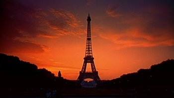 Movie still from “A New Kind of Love” (1963), directed by Melville Shavelson – The eiffel tower is silhouetted against the sunset; Extreme Wide shot, Low angle