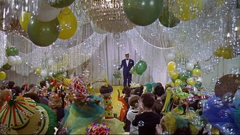 Movie still from “A New Kind of Love” (1963), directed by Melville Shavelson – A crowd of people sitting and standing in a room with balloons; Extreme Wide shot, High angle