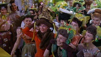 Movie still from “A New Kind of Love” (1963), directed by Melville Shavelson – A group of women dressed up in costumes for a party; Medium shot, High angle