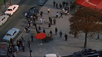 Movie still from “A New Kind of Love” (1963), directed by Melville Shavelson – An overhead view of a crowd of people walking on a street; Extreme Wide shot, High angle
