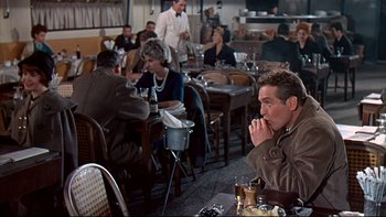 Movie still from “A New Kind of Love” (1963), directed by Melville Shavelson – A group of people sitting at a table in a restaurant; Medium shot, Over the shoulder angle