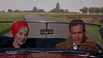 Movie still from “A New Kind of Love” (1963), directed by Melville Shavelson – A man and a woman sitting in the back seat of a car; Medium shot, Low angle