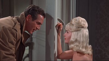 Movie still from “A New Kind of Love” (1963), directed by Melville Shavelson – A man and a woman are looking at each other; Medium shot, Over the shoulder angle