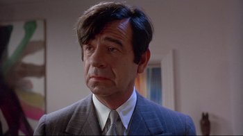 Movie still from “A New Leaf” (1971), directed by Elaine May – A person wearing a suit and tie; Close Up shot, Low angle