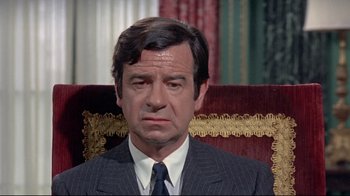 Movie still from “A New Leaf” (1971), directed by Elaine May – A person wearing a suit and tie; Close Up shot, High angle