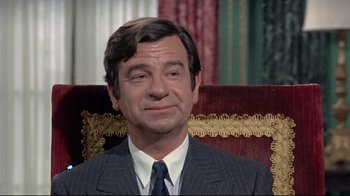 Movie still from “A New Leaf” (1971), directed by Elaine May – A person wearing a suit and tie; Close Up shot, High angle